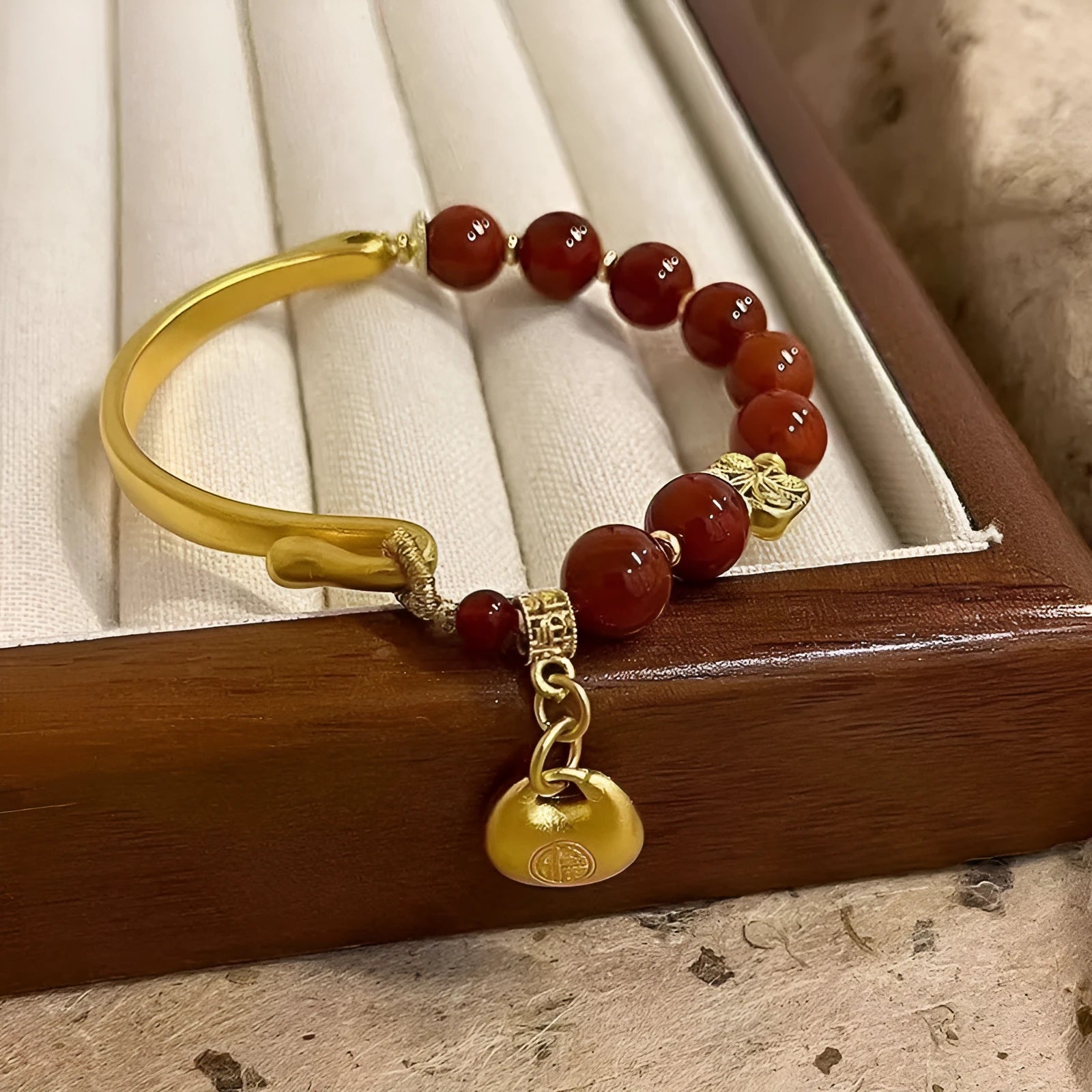 Golden south red agate character ingot bracelet handmade from glass and coloured glaze