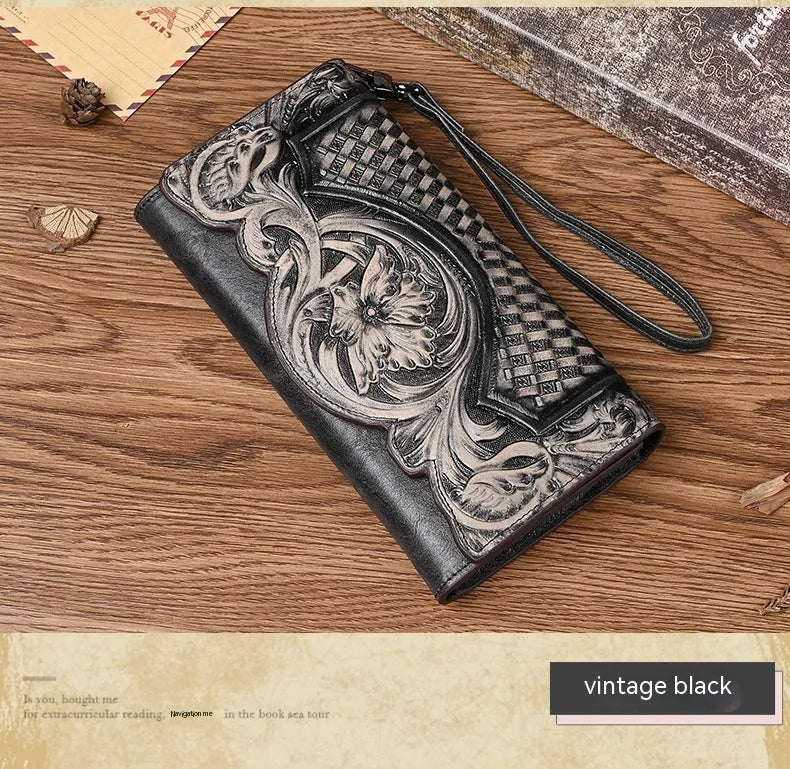 Brown tri-fold leather wallet with deep embossed floral pattern, shown open to reveal card slots and lining.