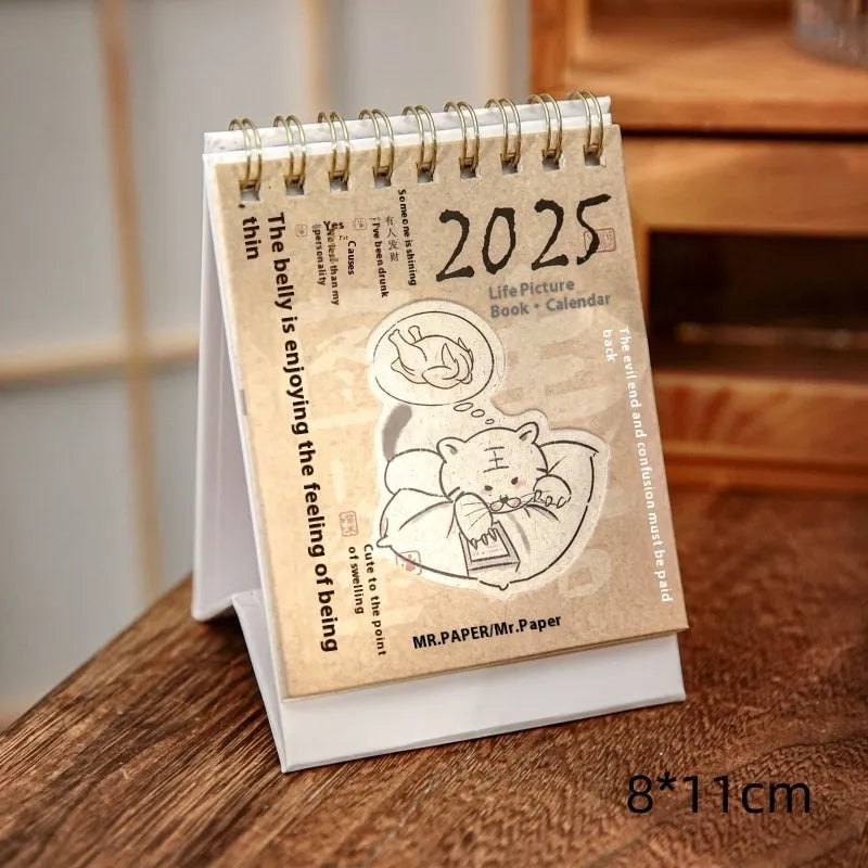 Four mini paper desk calendars for 2025 with different motivational themes in simple modern design