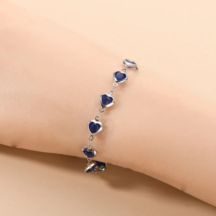 Geometric devil's eye stainless steel bracelet with colourful electroplated finish and oval pendant