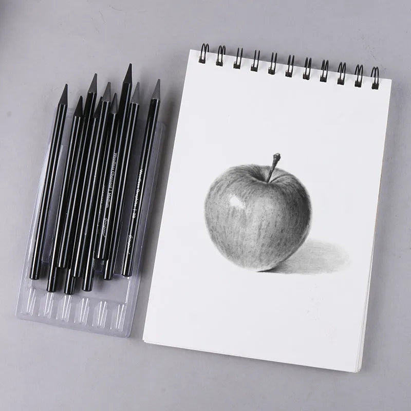 Set of nine drawing pencils with wooden shells, comprising six graphite and three carbonised pencils, on a suction card.