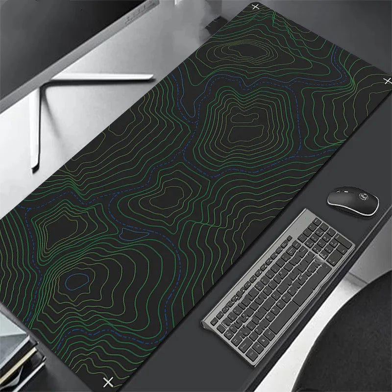 All black extra long mouse pad with precision overlock stitching on a desk