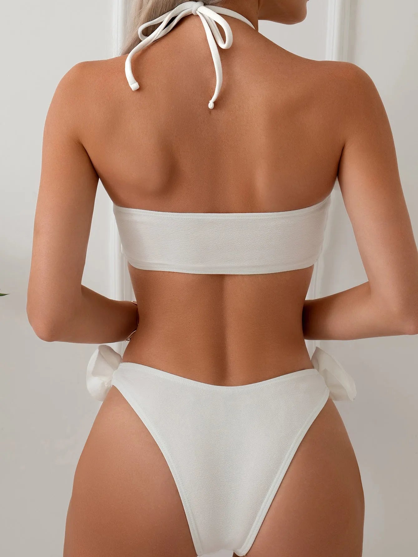 White halter neck lace-up swimsuit bikini set with three-dimensional floral pattern on briefs