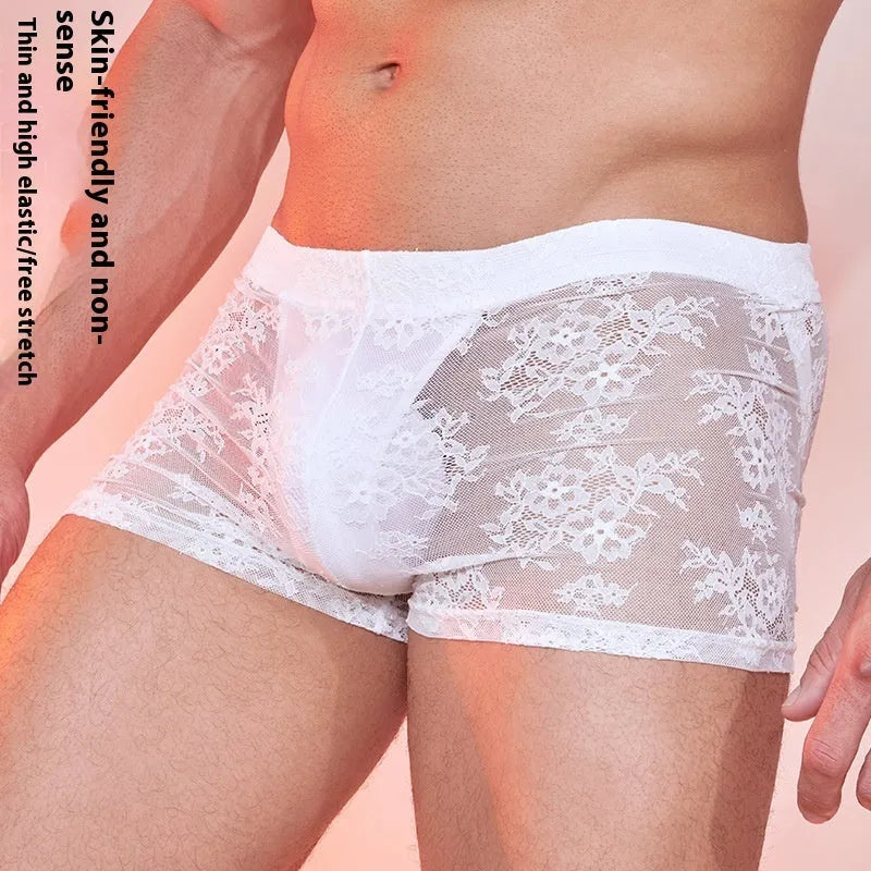 Fashion Personality men's black boxers with a white lace trim detail laid flat.
