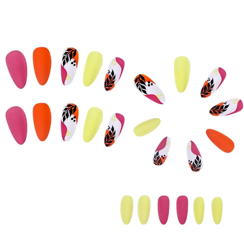 Set of four Wear Armour medium almond shaped frosted nail stickers showing French leaves, leopard print, macarons, and colourful plating designs.