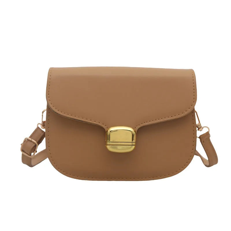 Simple PU leather women's handbag showing interior zipper coin compartment and phone pocket.