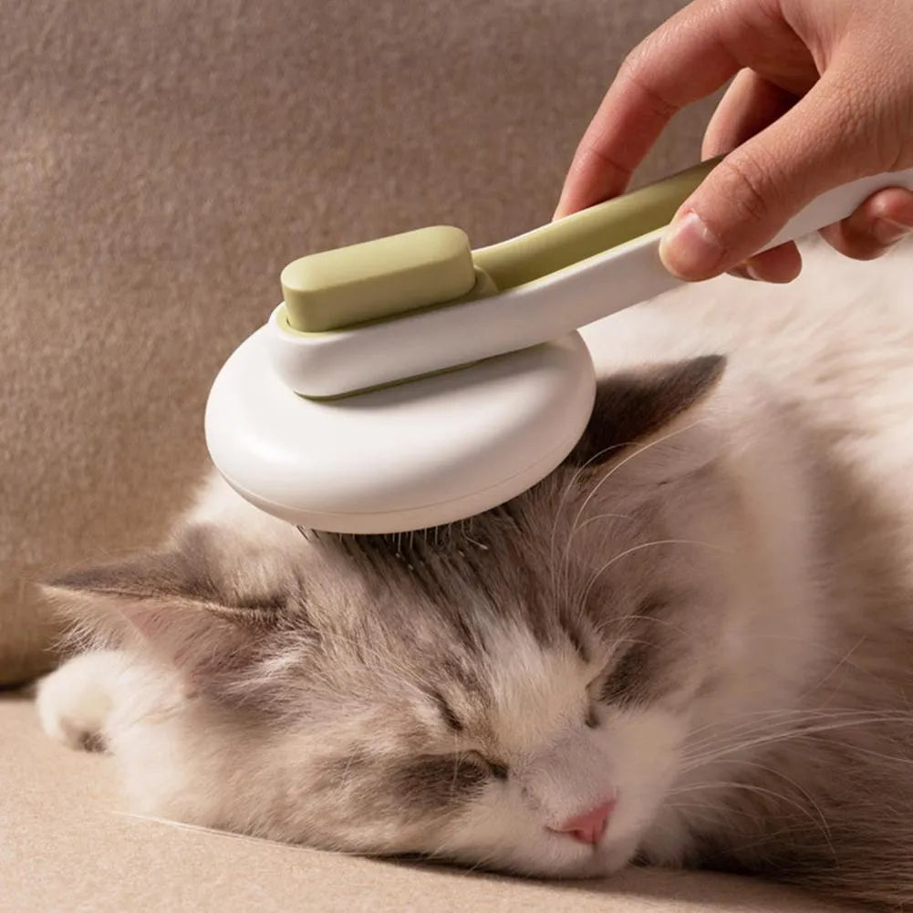 Blue automatic pet grooming comb with round brush head and ergonomic handle