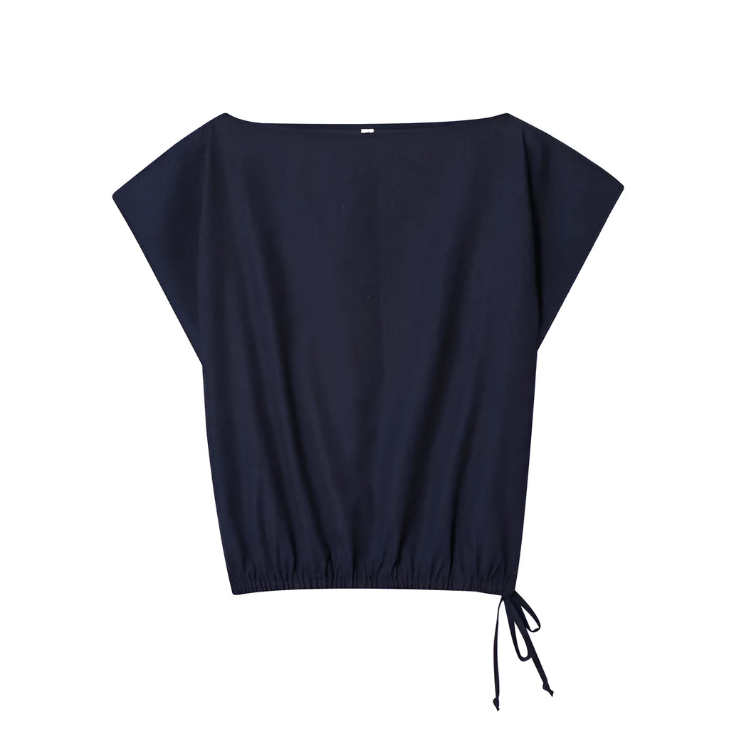 Women's high-neck blouse with flounced sleeves and matching wide-leg trousers in a formal suit set.
