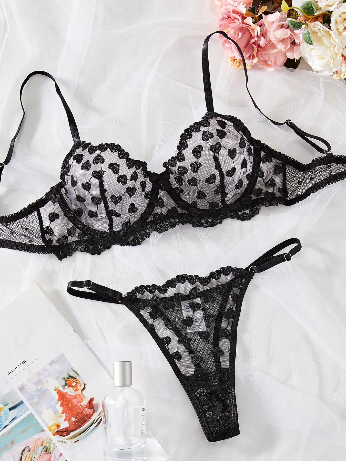 Women's black mesh suit set with lace trim showing crop top and high-waisted shorts combination