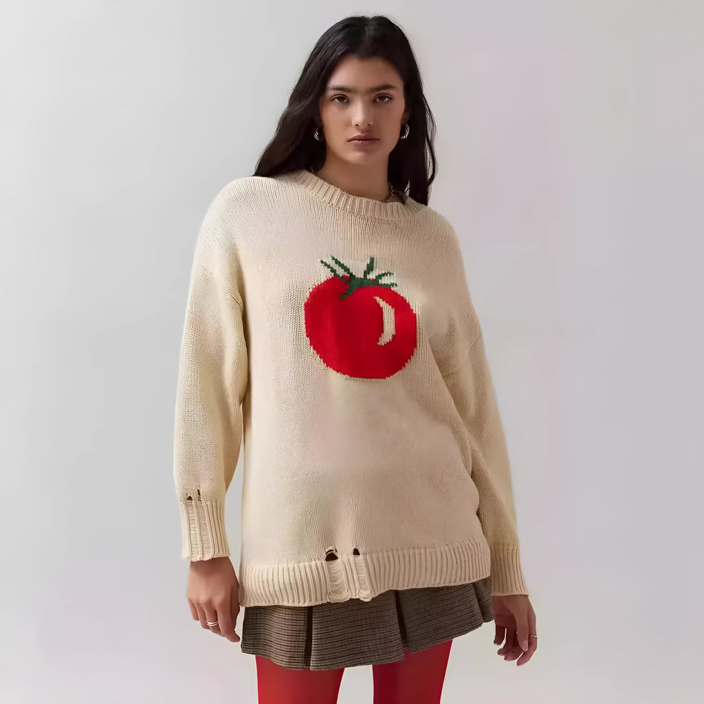 Beige women's loose-fitting acrylic jacquard knit sweater with round neck and long sleeves.