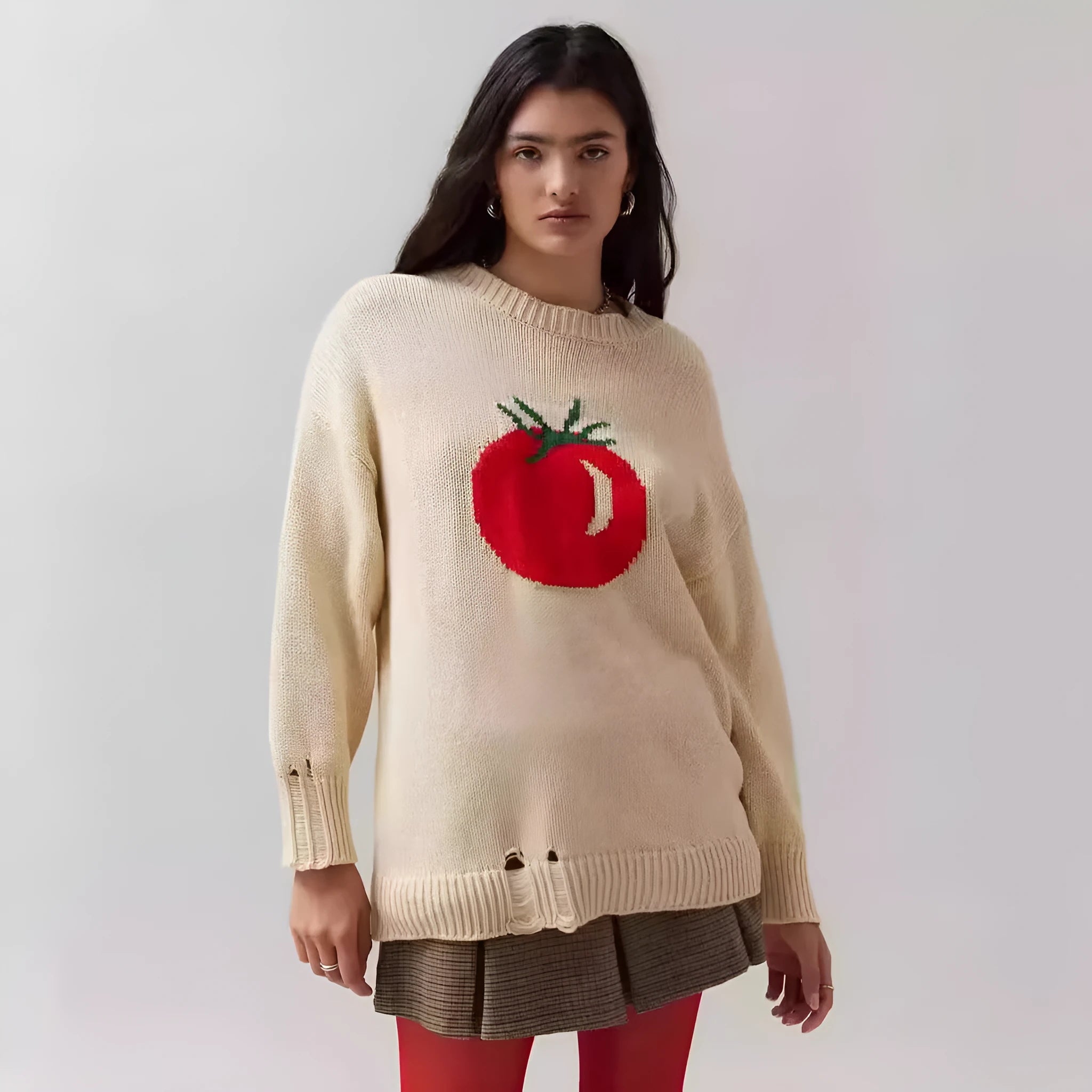 Beige women's loose-fitting acrylic jacquard knit sweater with round neck and long sleeves.