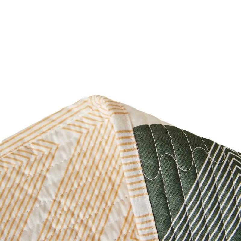 Pure cotton printed bed sheet three-piece set laid out on a bed, showing a modern pattern.