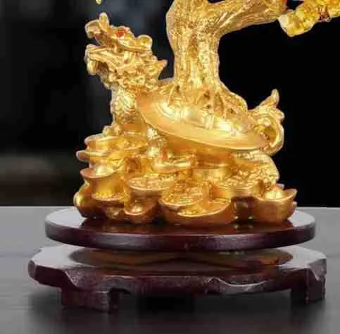 Citrine-coloured resin money tree Feng Shui ornament with a small water turtle design.