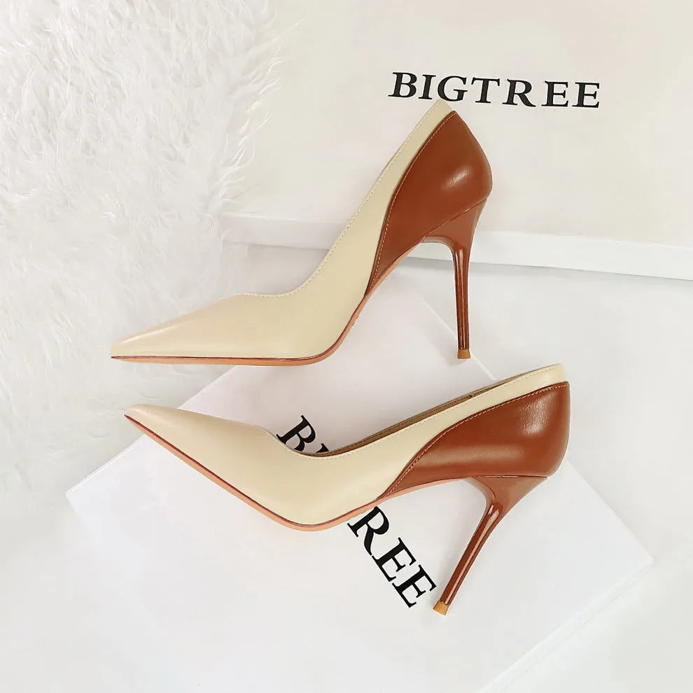 Women's black retro stiletto high heel pumps with pointed toe and super high heel
