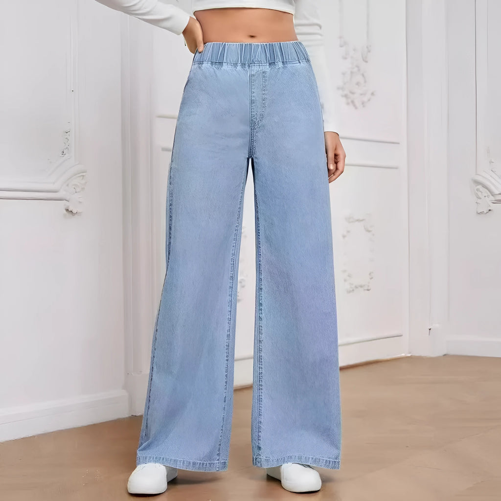 Plus size light blue washed denim trousers with a wide-leg straight cut and zip fly.