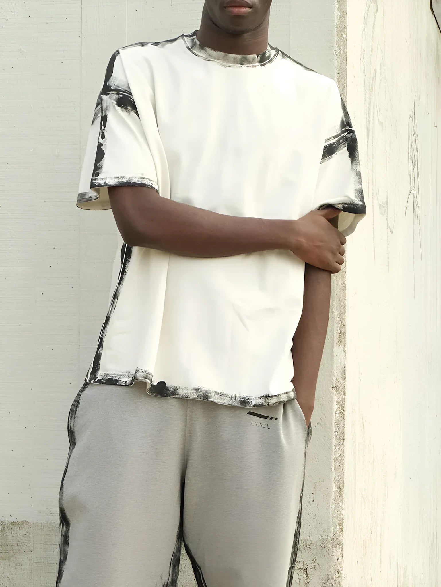 White casual short sleeve top with draped design and printed pattern
