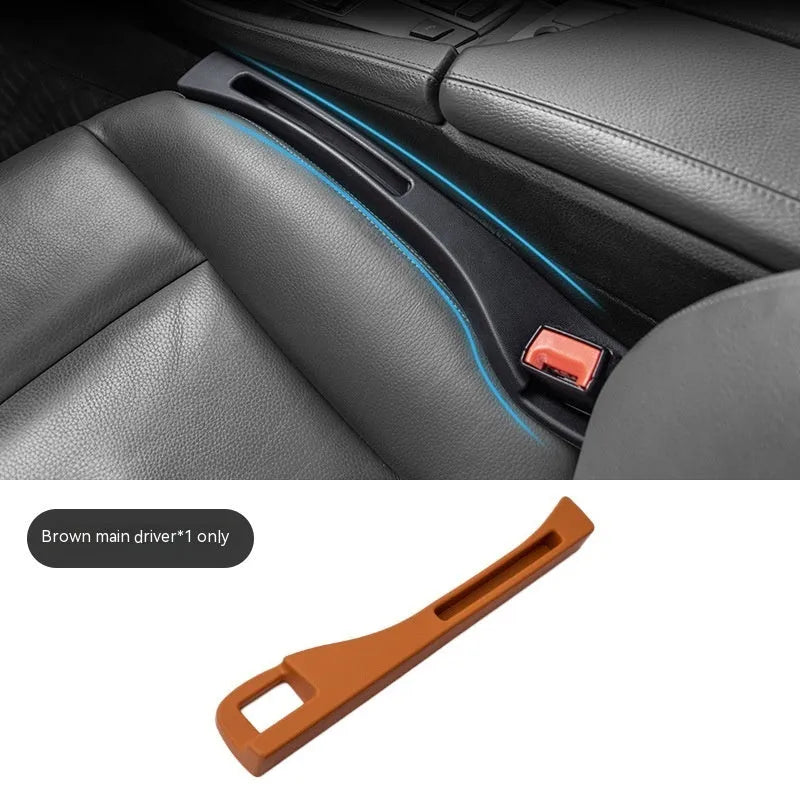 Black plastic car seat gap storage organiser box with handle inserted between vehicle seats