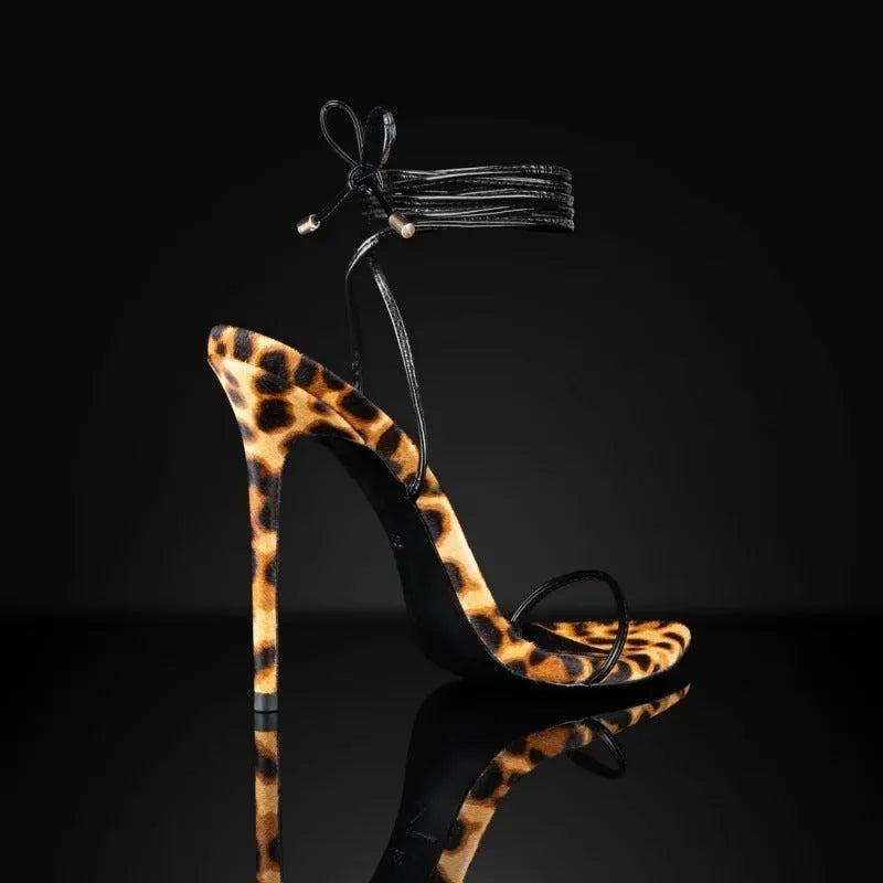 Women's leopard print Roman sandals with pointed toe design and lace-up buckle closure