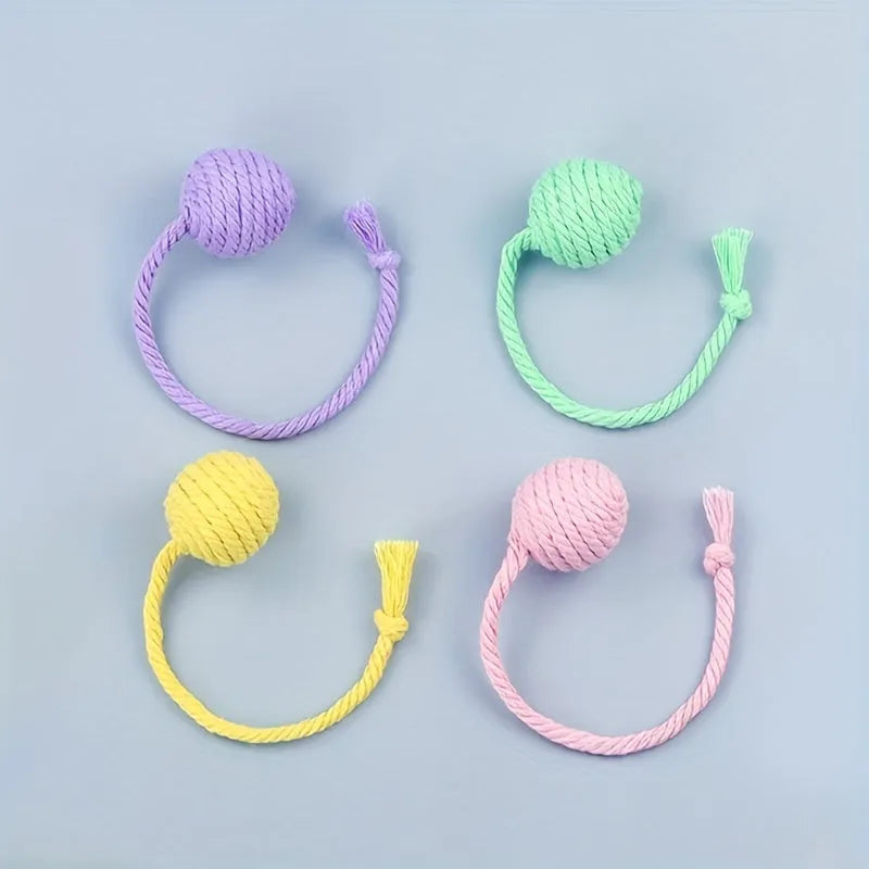Colourful cat toy ball with rope attachment and built-in bell for interactive pet play