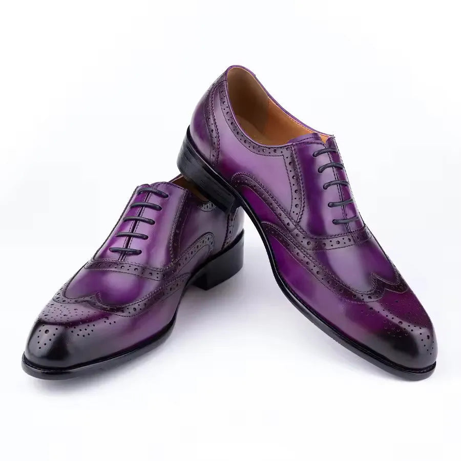 Men's purple Oxford shoes with hand carved detailing and pointed toe style on rubber sole
