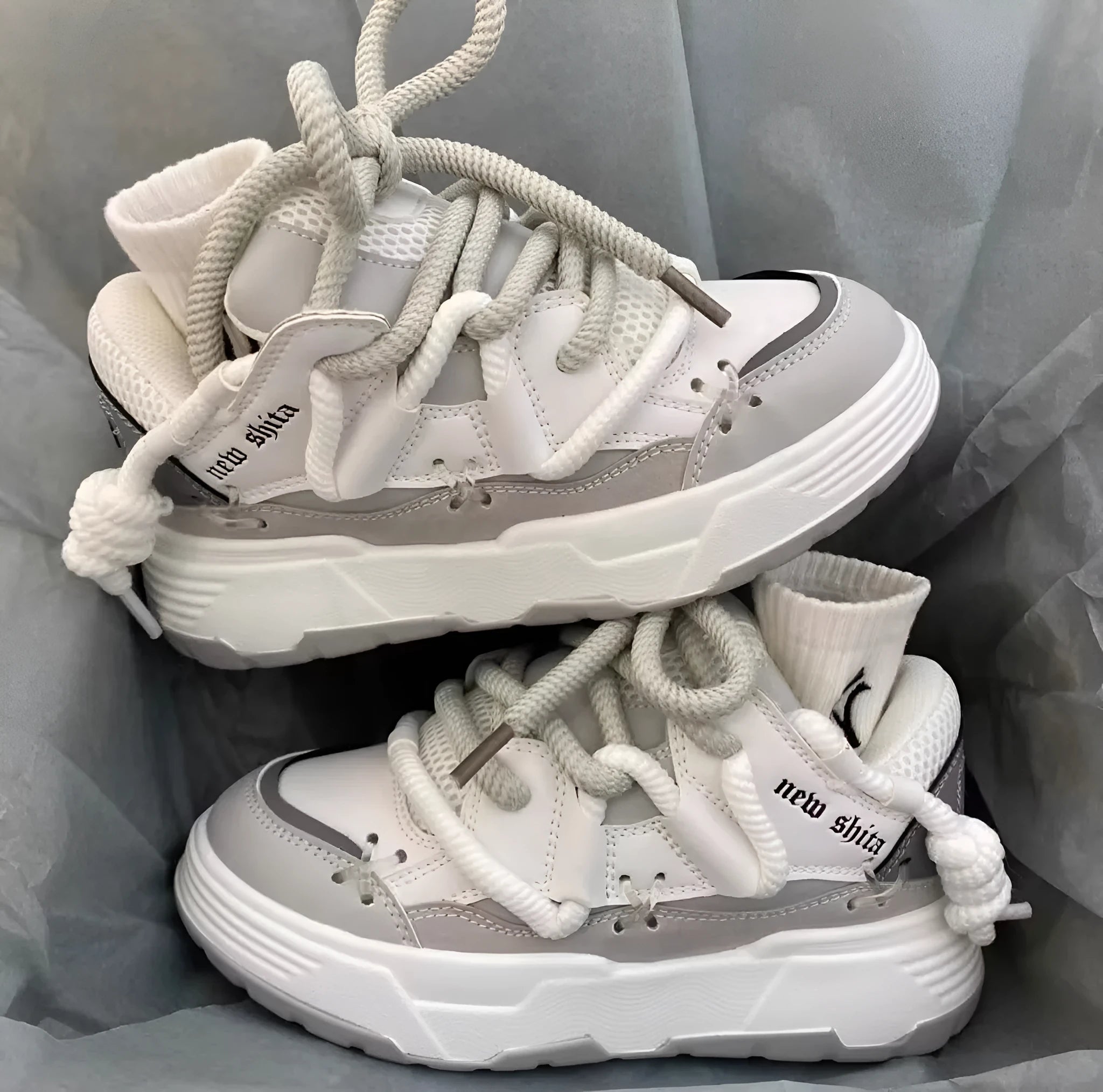 Women's grey chunky platform sneakers with thick soles and lace-up front