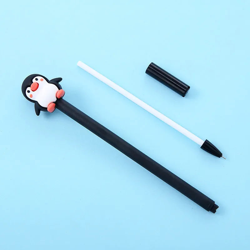 Peacock blue gel pen with cartoon penguin design and silicone grip, showing 0.5mm tip.