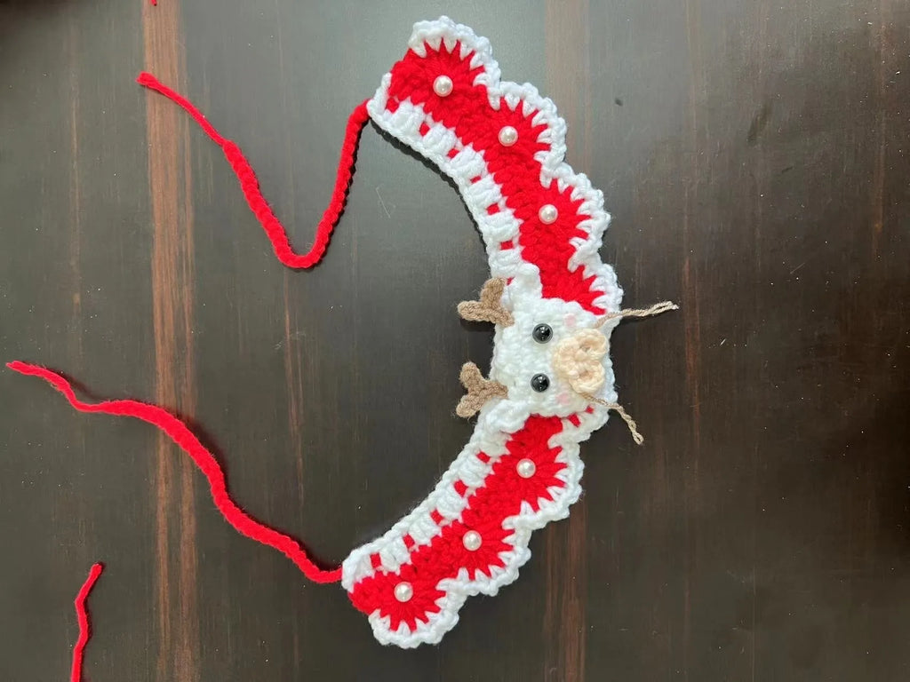 Knitted wool Christmas pet scarf clipped to dog collar in striped Santa pattern