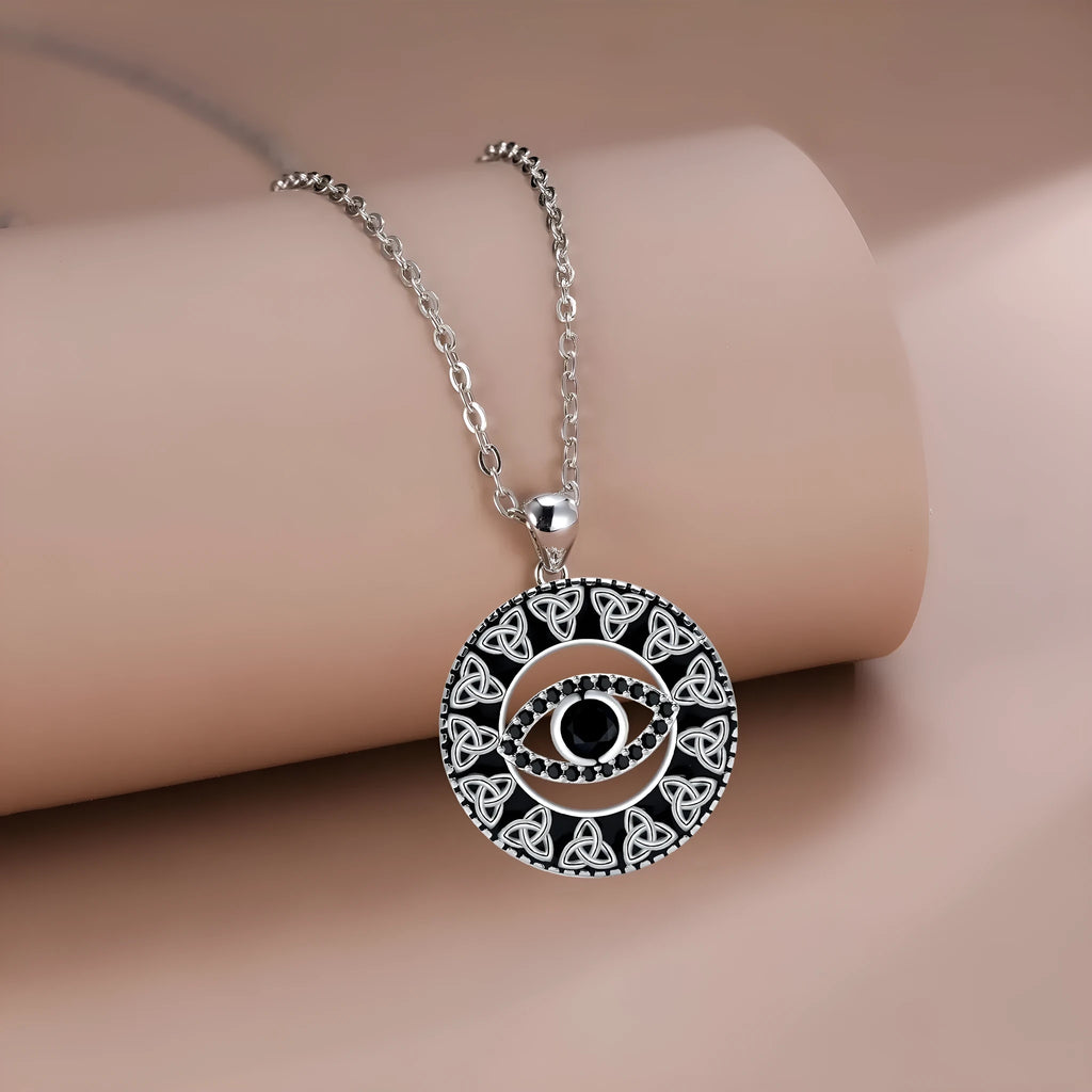 Copper devil's eye pendant necklace with a cross chain for women.