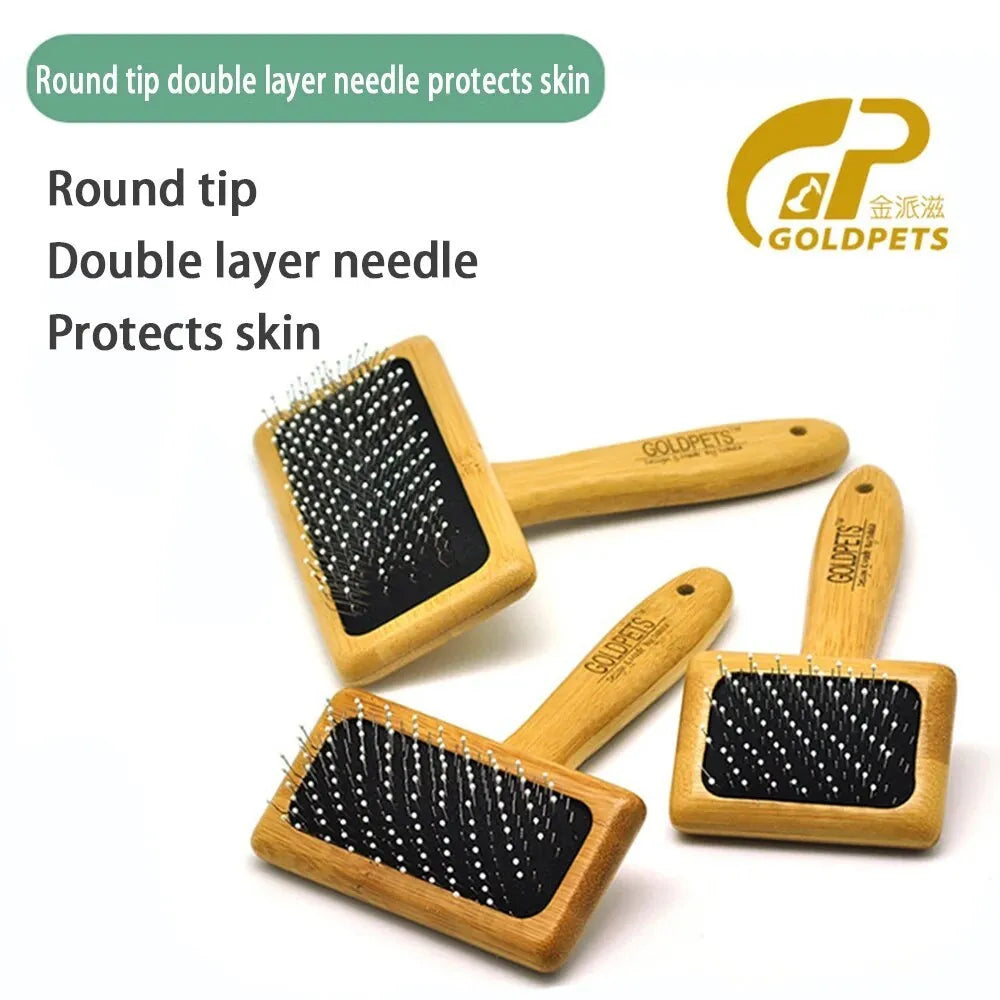 Goldpets bamboo and wood slicker brush for pets with stainless steel pins on a wooden handle.