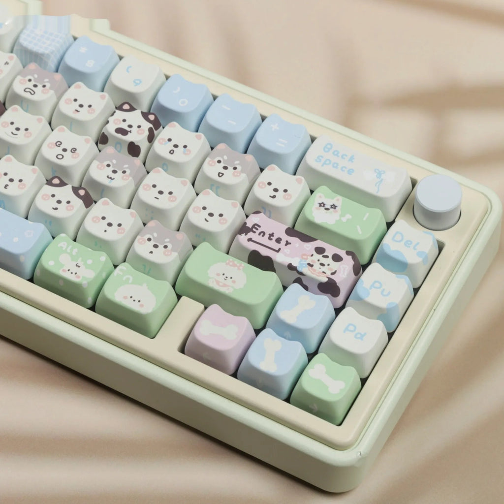 Colourful PBT key cap set for mechanical keyboards with printed cat and puppy designs.