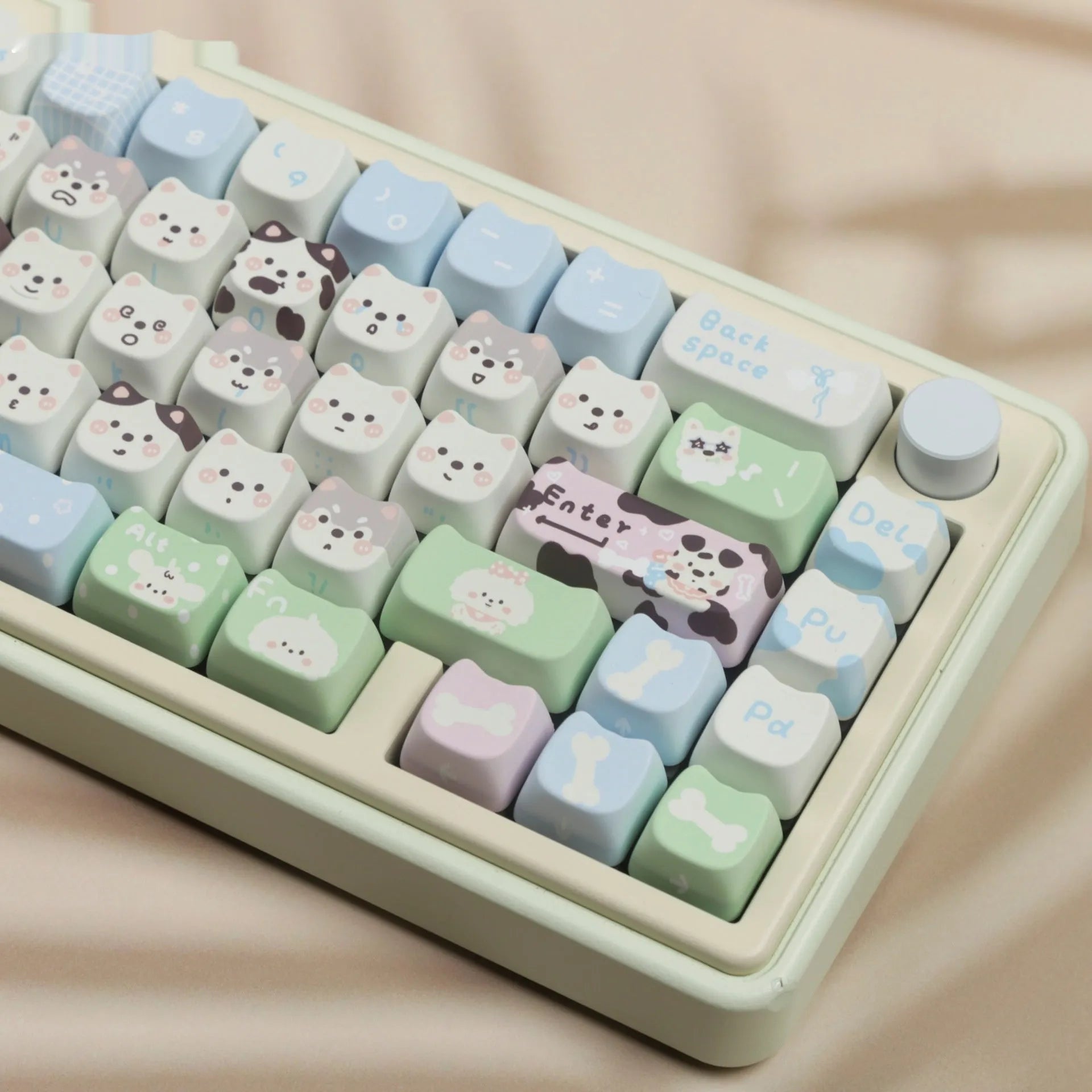 Colourful PBT key cap set for mechanical keyboards with printed cat and puppy designs.