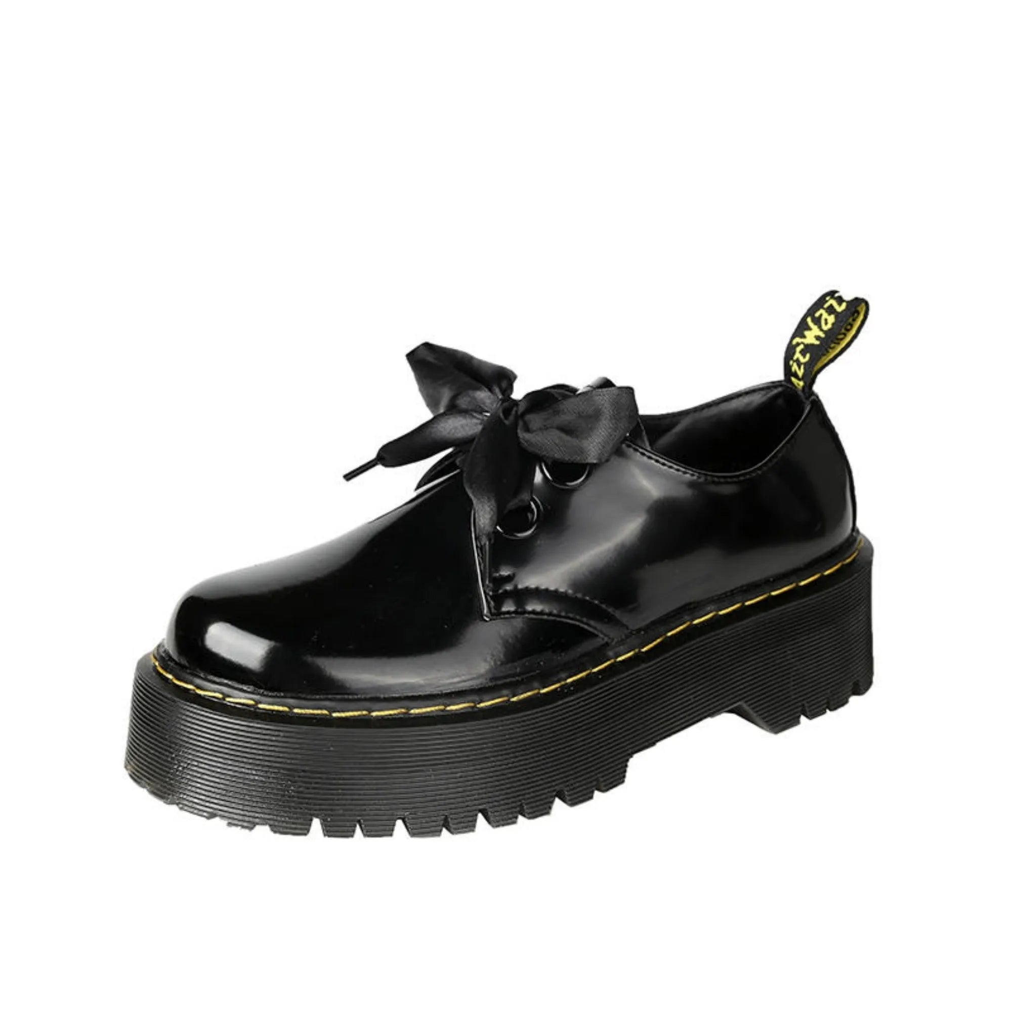 Black women's thick soled lace-up shoes with a cross-strap and ribbon detail on the front.