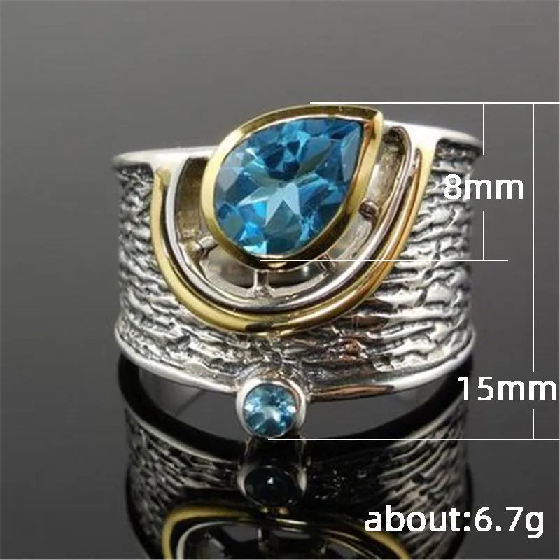 Women's Chinese style drop shape ring with blue rhinestone zircon centrepiece on alloy band