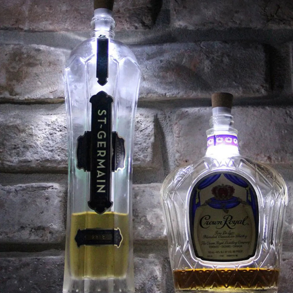 White plastic USB-rechargeable LED cork light for inserting into wine bottle neck.