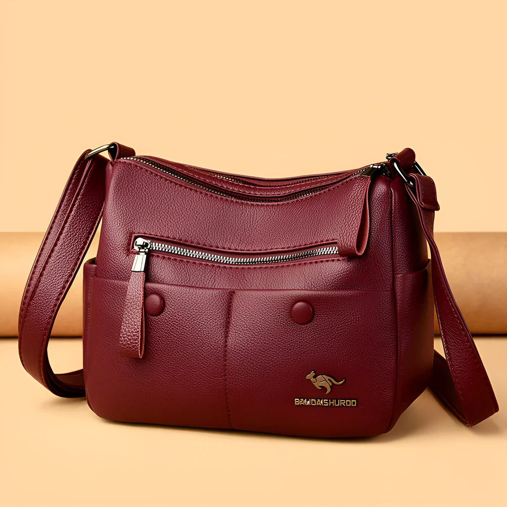 Soft black PU leather women's crossbody bag showing external pockets and a horizontal square shape.