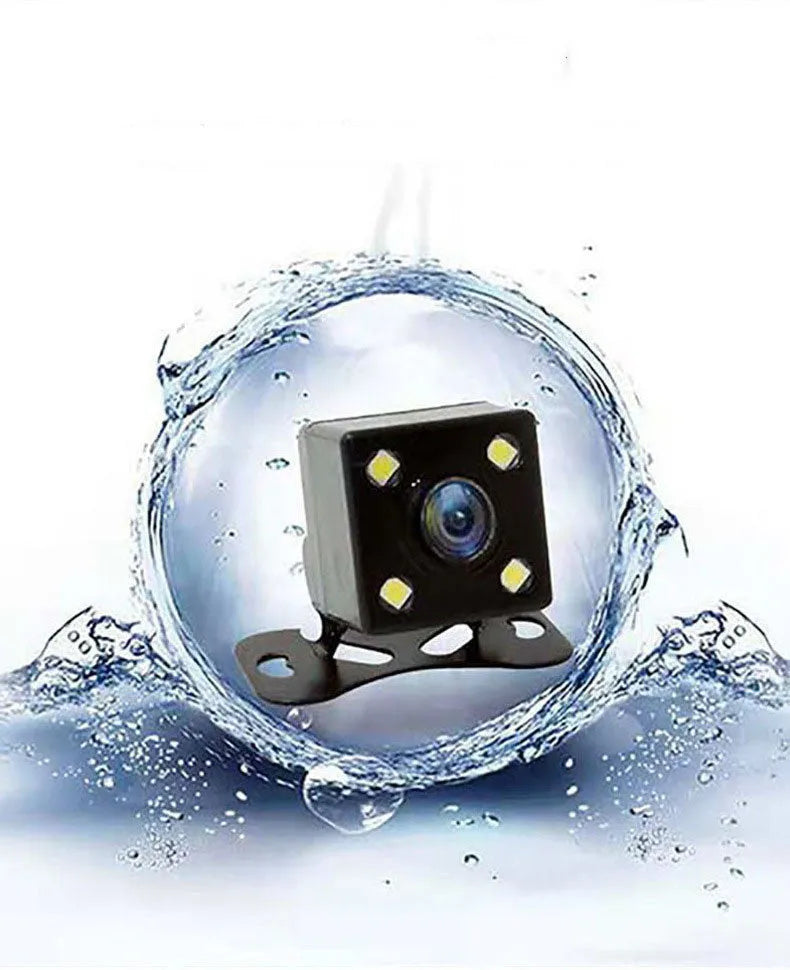 Black three-lens car dash cam with touch screen display, shown with car power cable