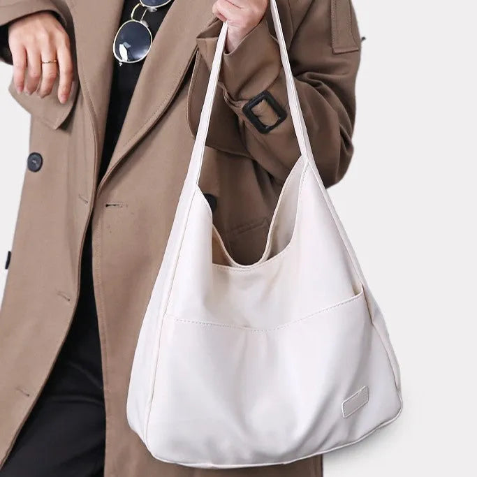 Women's soft PU shoulder bag in European retro style with zipper compartment and sewing thread details