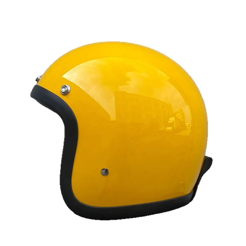Retro-style half motorcycle helmet in fibreglass, shown in Cement Grey colour on a stand.