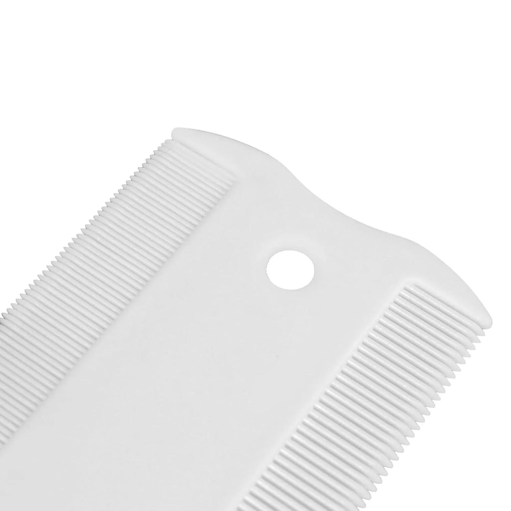 Small white double-sided plastic flea comb for dogs and cats on a blue background.