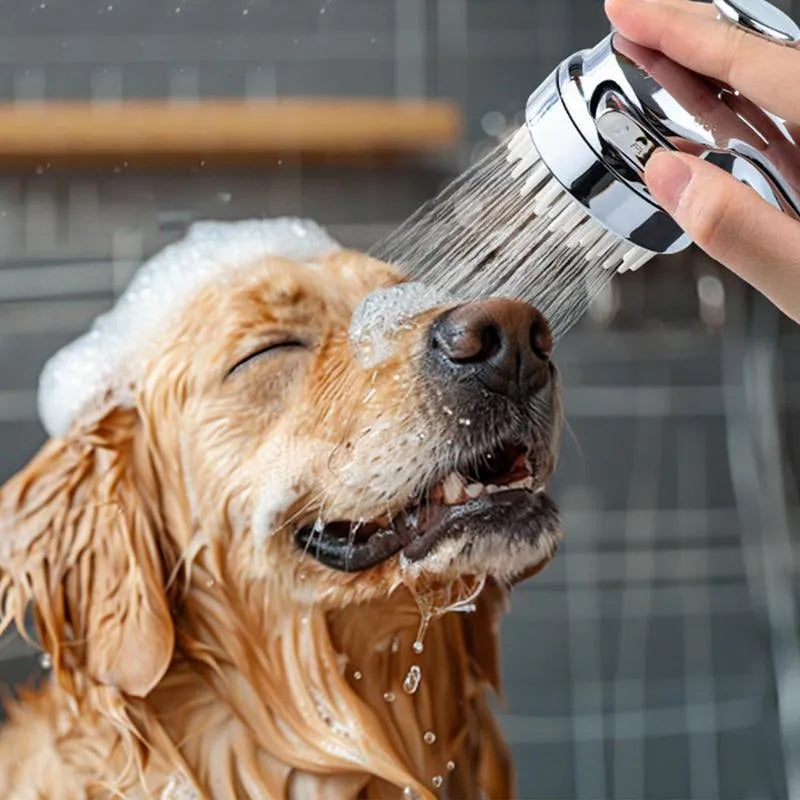 Silver dog shower attachment with silicone comb teeth and ergonomic grip for pet bathing