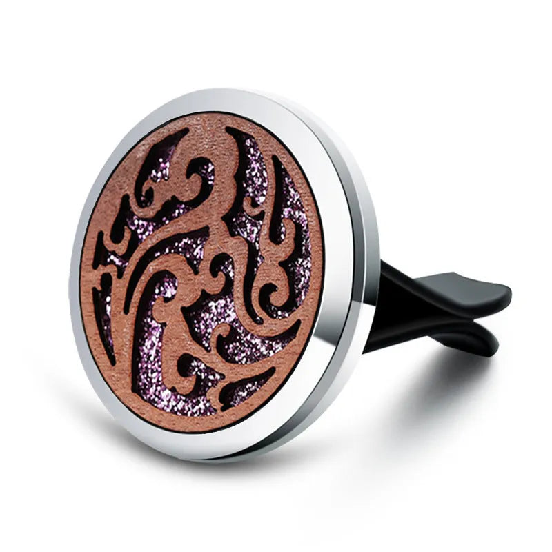 Round car vent aromatherapy clip in alloy wood construction showing hollow centre for incense
