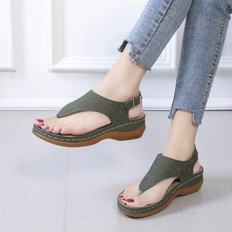 Women's wedge heel casual sandals in red with an adjustable back strap and flip-flop style.