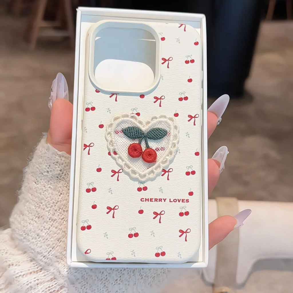 White lychee pattern iPhone case with three-dimensional embroidered cherry detail and anti-fall silicone cover