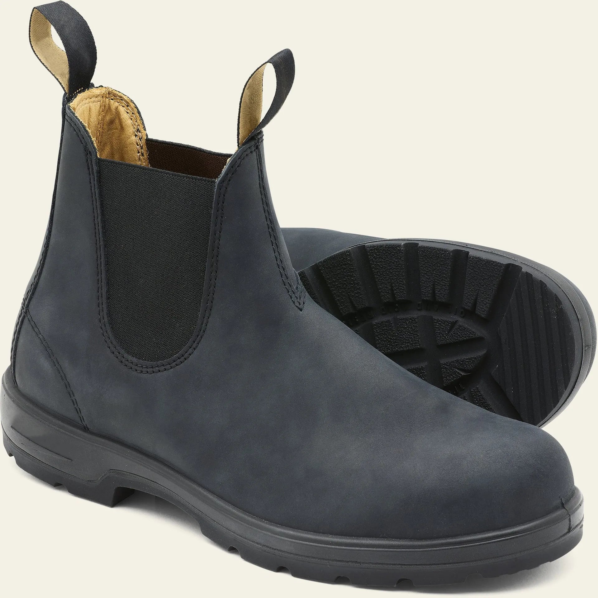 Vintage grey unisex Chelsea boots on a wooden floor, showing frosted PU upper, round toe, low heel, and car stitch detail.