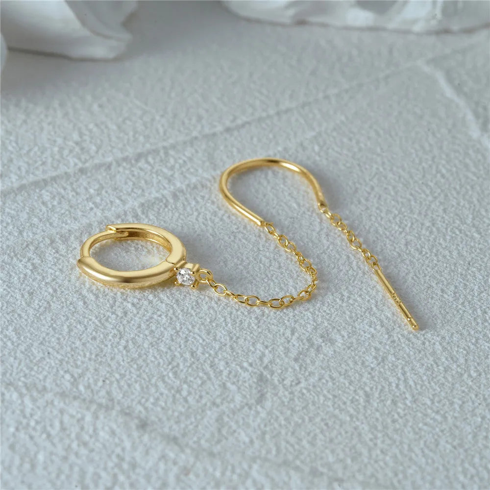 S925 sterling silver ear stud with gold electroplated flower and dangling tassel chain design.