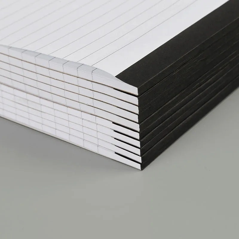 A4 tearable notebook with gridded ivory pages and a paper cover.