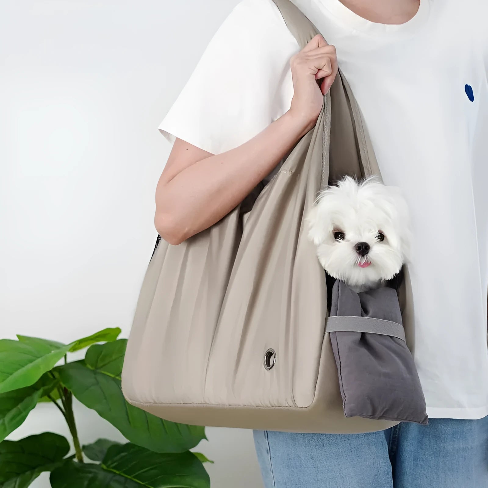 Apricot-colour cloth pet carrier handbag with mesh panels and a shoulder strap.