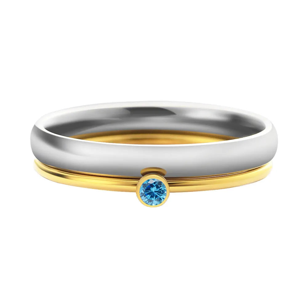 A geometric titanium steel ring with engraved details and a December birthstone colour accent.