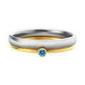 A geometric titanium steel ring with engraved details and a December birthstone colour accent.