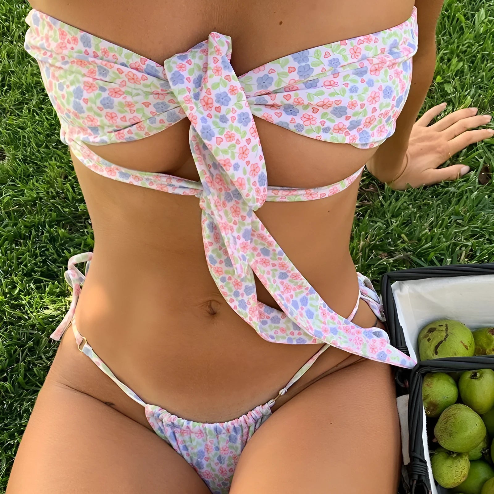 Women's one-piece swimsuit with lace-up criss-cross back and high-cut leg in a floral print.